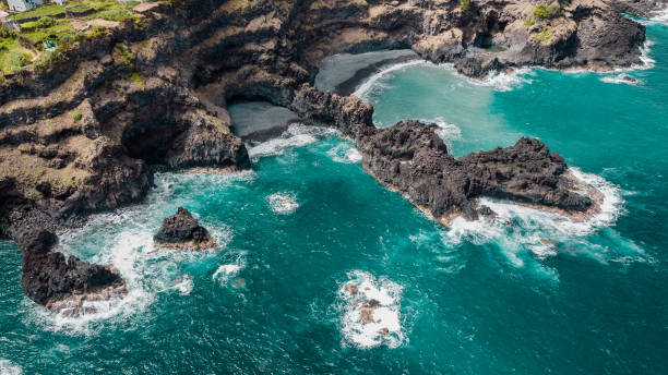 istock Empty beach from above. Atlantic ocean coastline with red cliffs and rocks. Madeira island, Portugal. Aerial drone photography 1496670739