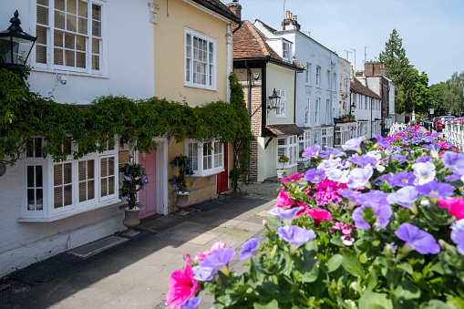 Flowers in the street against the backdrop of old houses in Old town Hemel Hempstead, Hertfordshire County, England.