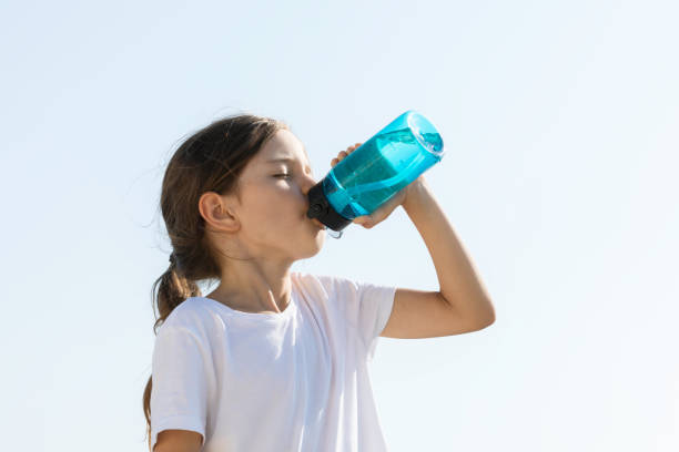 istock Little Girl Drinking Water 1496675826