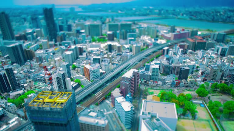 A timelapse of miniature cityscape near Yodo river in Osaka wide shot