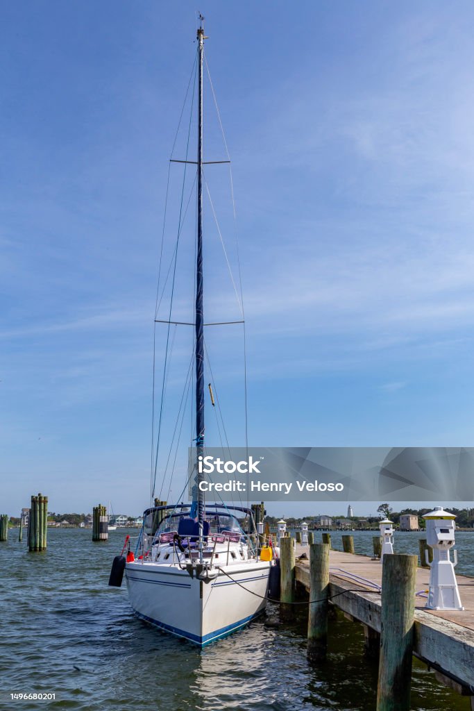 Sail boat docked Sail boat docked at a port in Ocracoke, NC Bay of Water Stock Photo