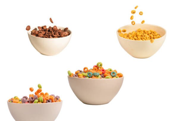 istock Colorful cereal box for morning breakfast. Corn flakes falling to the white bowl. Motion. 1496681567