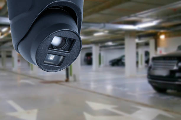 istock cctv camera installed on the parking lot to protection security. Copy space. 1496684985
