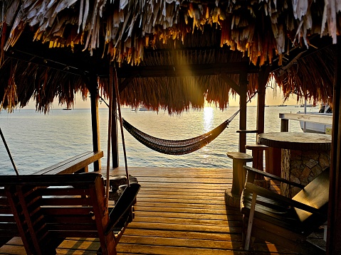 Sunset from a boat dock with hammock