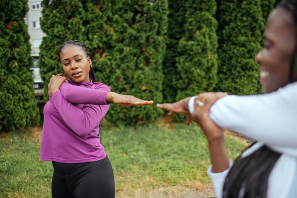 istock Two women exercising together 1496690370