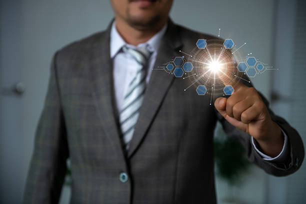 istock Young businessman pushing modern button of hi-tech type Data analysts work in business analytics and planning workflow management systems 1496696740