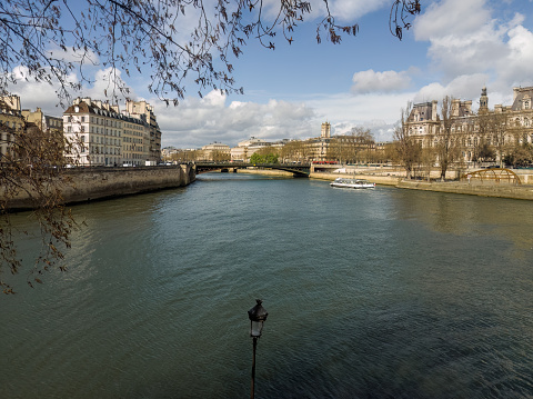 View towards Seine river and Pont d'Arcole bridge from Place Louis Aragon in Paris, France. March 26, 2023.