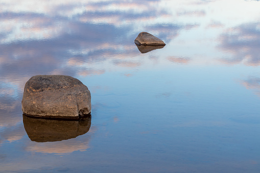 Two stones in beautiful clear and calm water