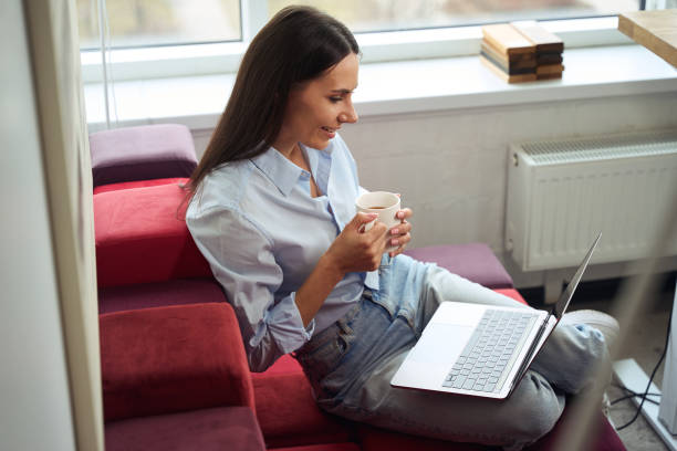 istock Corporate worker reading something on computer monitor during tea break 1496700823