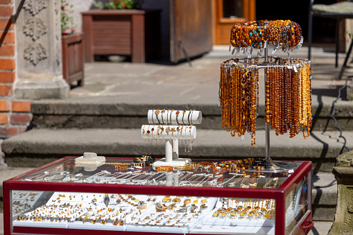 Gdansk, Poland - June 2, 2023: Mariacka street, typical stoop and jewelery shop with amber called baltic gold,  Main city