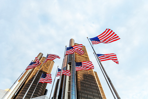 Skyscrapers and American flags. Detroit, Michigan, USA