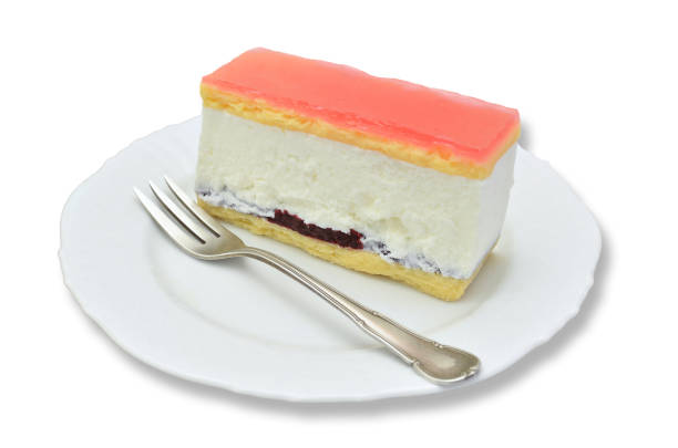 Piece of Cheese fancy cake on white Plate stock photo