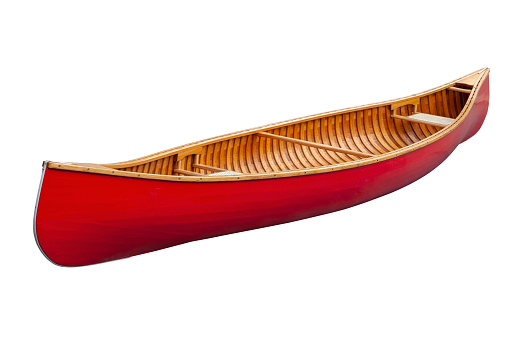 Red wooden canoe with cane seats isolated on a white background