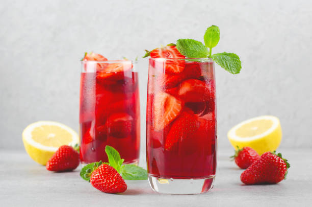 istock Strawberry Drink, Refreshing Summer Cocktail, Lemonade, Iced Tea, Red Cold Drink on Bright Background 1496711152