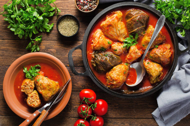 istock Cabbage Rolls with Ground Meat, Rice and Vegetables also known as Sarma, Golubtsy, Dolma on Rustic Wooden Background 1496714256