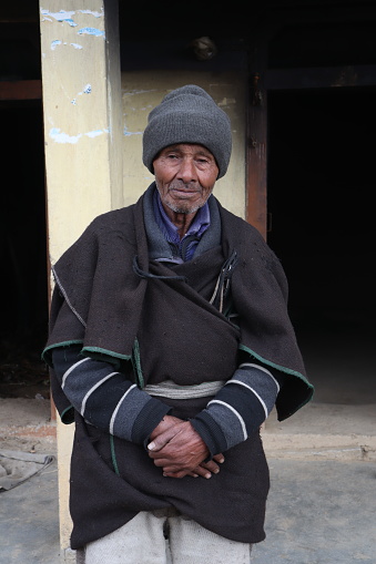 Chamoli, Uttarakhand, india. Portrait of a old remote himalayan village man wearing his local traditional dress in India.