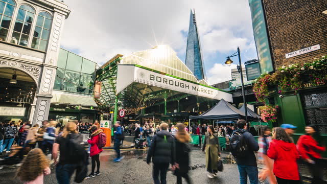 Time lapse of Crowd people and tourist walking and shopping food at Borough Market in London, United Kingdom