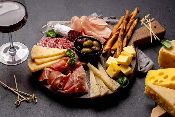 istock Antipasto board with meat and cheese snacks 1496716134