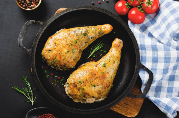istock Baked Stuffed Chicken Legs in a Pan on Dark Backround 1496718810
