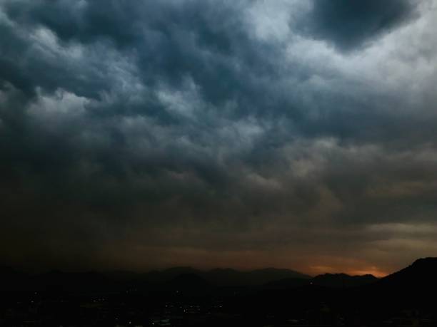 istock Dramatic sky featuring a blanket of dark storm clouds. 1496718868