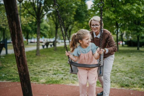 istock Little girl swinging on a swing 1496718958