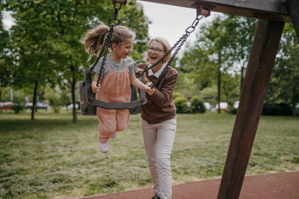 istock Girl loves swinging 1496719780