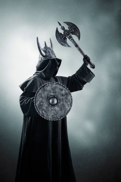 istock Warrior with horned helmet, double headed battle axe and round shield in the dark 1496719896