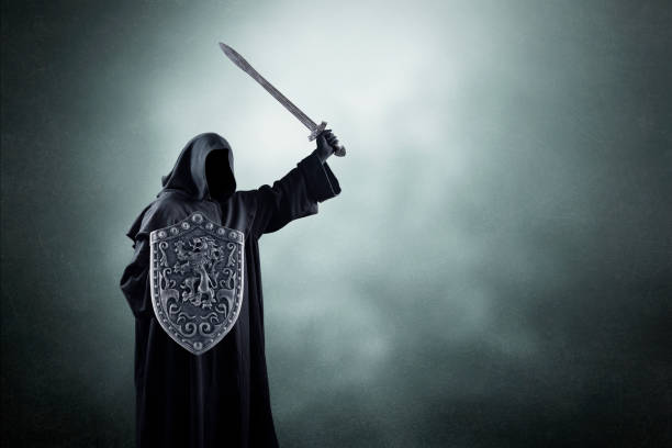 istock Dark knight with sword and shield over dark misty background 1496720061