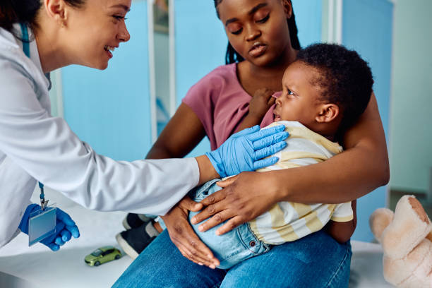 istock Ill black boy and his mother during a visit at pediatrician's office. 1496720413