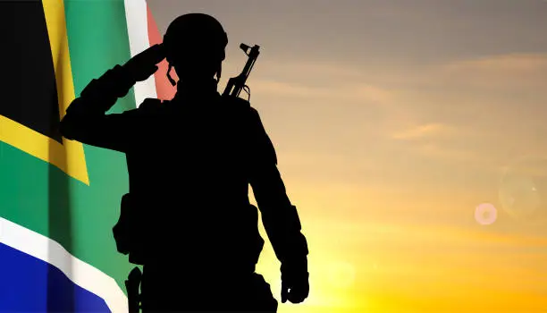 Vector illustration of Silhouette of a saluting soldier with South Africa flag