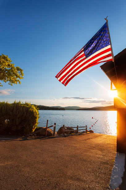 istock Sunrise over boat ramp and flag 1496723177