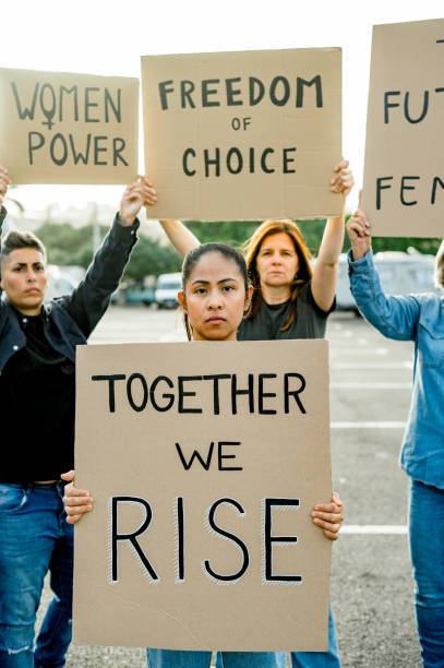 istock Group of female protesters with placards 1496727056