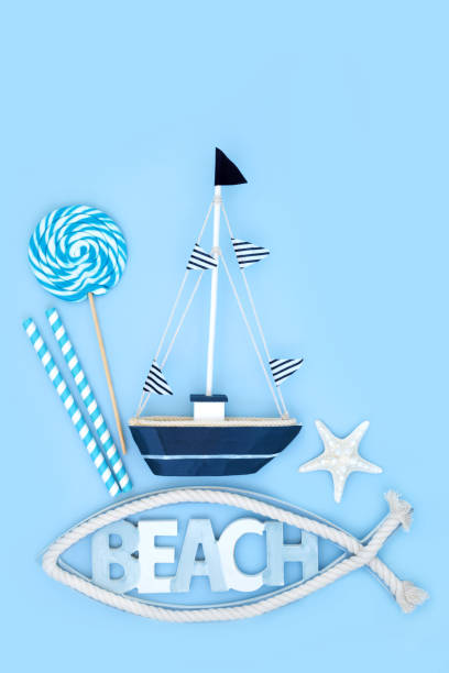 istock Summer Beach Symbols with Toy Sailing Boat 1496729739