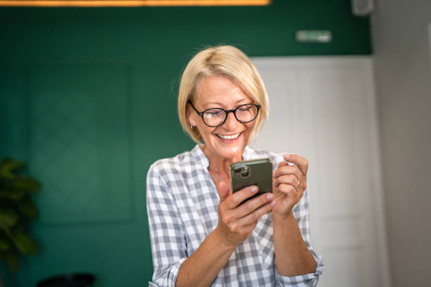istock Woman with use mobile phone smartphone send sms 1496731480