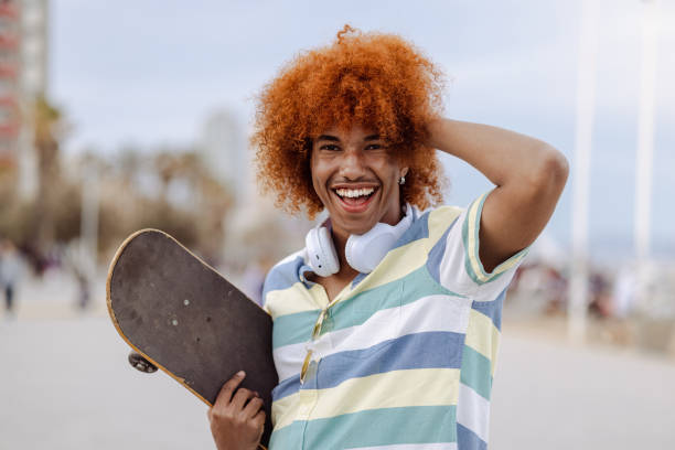 istock Portrait of a man holding a skateboard 1496731531
