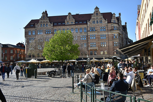 Lilla Torg Malmo Sweden Scandinavian Northern Europe, Building Exterior, Malmo Little Square, Building Exterior, Retail Store, People Walking, Sitting Down, Eating And Drinking In A Restaurant During Springtime