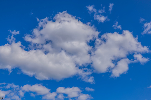 Close up view of white clouds in blue sky in sun day.