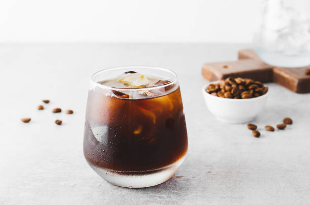 istock Iced Coffee, Cold Brew Coffee with Ice on Bright Background, Coffee Cocktail, Refreshing Beverage 1496733277