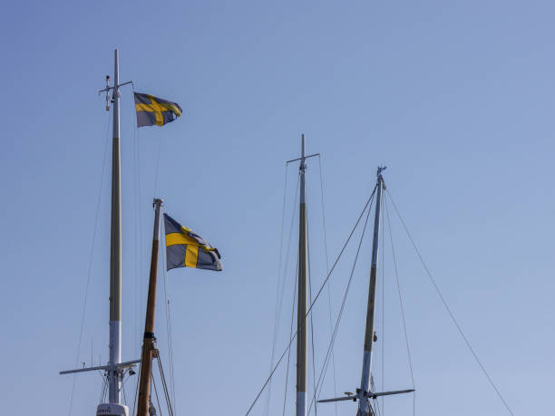 Low angle view of mast against clear sky