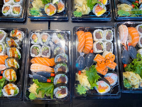 Colorful and delicious sushi selections packed in plastic to go containers at the Bergen, Norway fish market.