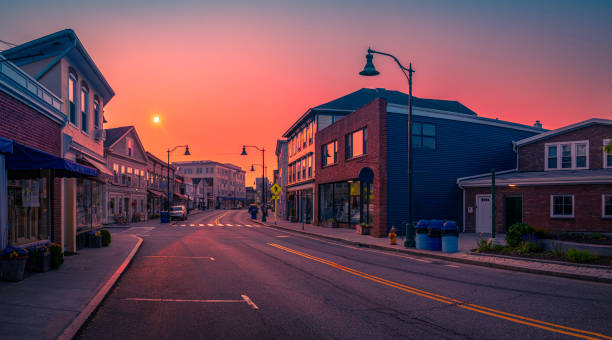 Sunrise and wildfire smoke over the Mystic downtown in Connecticut, the old city skyline, and buildings of New England stock photo