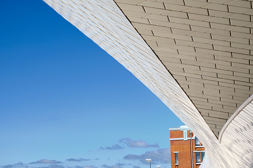Lisbon, Portugal — June 15, 2018: The MAAT is a cultural project for the city of Lisbon that is focused on three areas: art, architecture and technology. The museum is near the Tagus River and opened in June of 2016. The museum was designed by Welsh architect Amanda Levete.