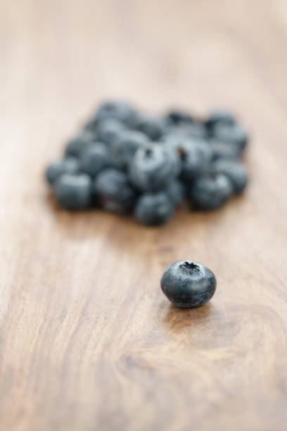 fresh garden blueberries on wood table, closeup photo