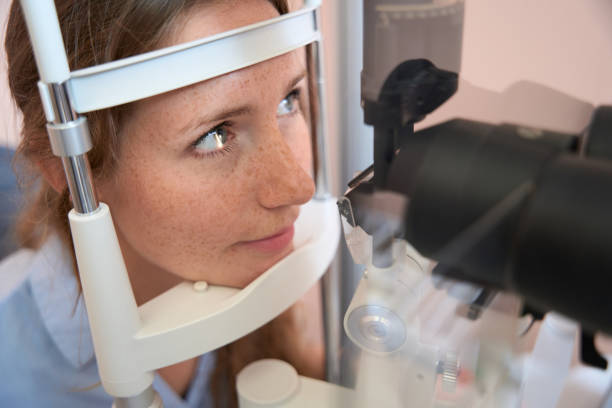 istock Beautiful female is getting eyesight correction in the ophthalmology center 1496743929
