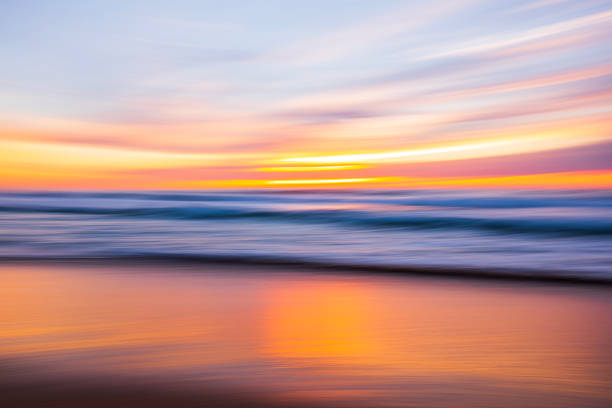 istock Motion blur pan seascape of light reflecting off waves and ocean surface 1496744155