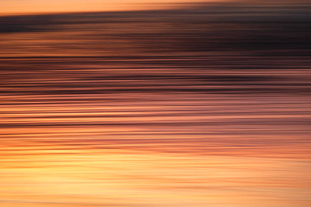 Motion blur capture of light reflecting off surface of wet sand