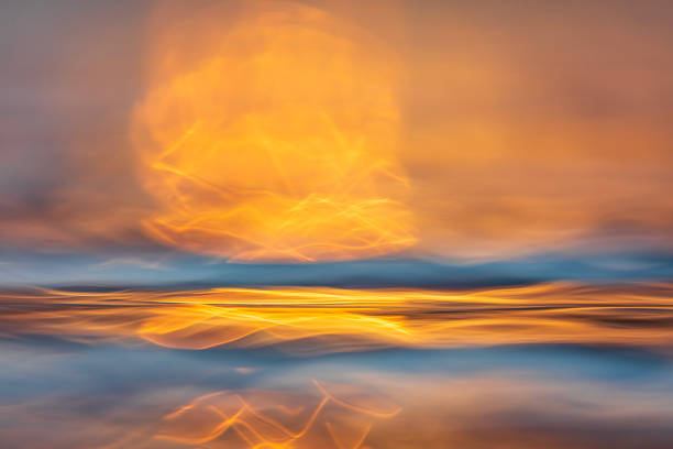 Abstract surface tension and natural patterns on water with golden light.