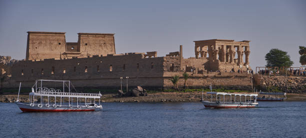 Philae temple complex ,an island-based temple complex in Aswan , Egypt. External daylight shot Philae temple complex ,an island-based temple complex in the reservoir of the Aswan Low Dam, downstream of the Aswan Dam and Lake Nasser, Egypt. External daylight shot temple of philae stock pictures, royalty-free photos & images