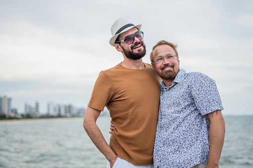 Portrait of gay couple on the beach