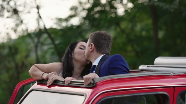 Romantic beautiful wedding couple laugh and kiss on honneymoon, slow motion